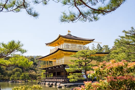 Kinkakuji (Golden Pavilion) is a Zen temple in northern Kyoto whose top two floors are completely covered in gold leaf.