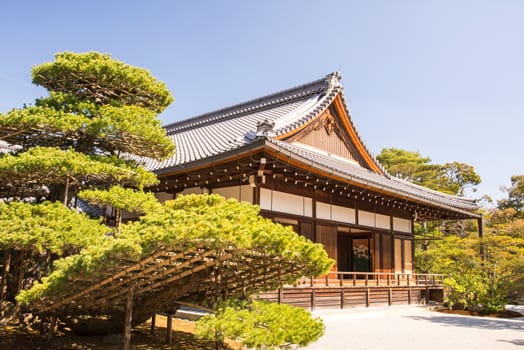 Kinkakuji (Golden Pavilion) is a Zen temple in northern Kyoto whose top two floors are completely covered in gold leaf.