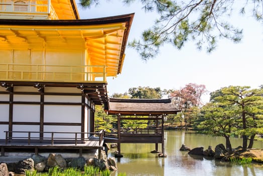 Kinkakuji (Golden Pavilion) is a Zen temple in northern Kyoto whose top two floors are completely covered in gold leaf.