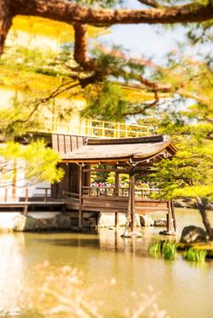 Kinkakuji (Golden Pavilion) is a Zen temple in northern Kyoto whose top two floors are completely covered in gold leaf.