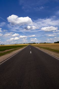 little asphalted road in the summer time