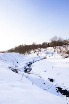  the small streamlet located in the woody district, in a winter season