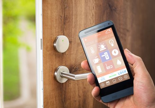 smart house, home automation, device with app icons. Man uses his smartphone with smarthome security app to unlock the door of his house.