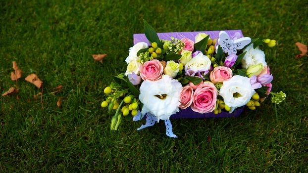 bouquet of flowers on the green grass with copy paste