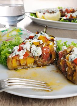 Stuffed eggplant with ricotta and vegetables in lettuce 