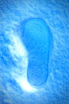 Winter background conceptual image. Footstep on the snow. 