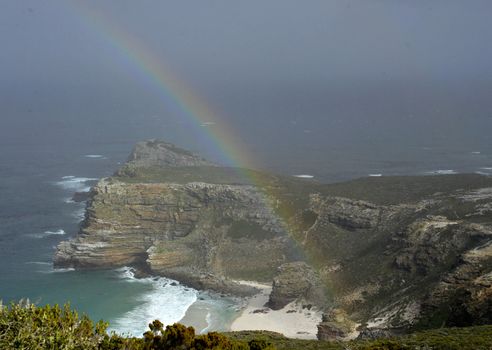 Rainbow over the Cape of Good Hope in storm weather. South africa