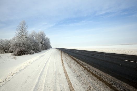   the small asphalted road. winter season