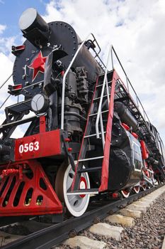   the ancient engine standing on rails which it is used as an example