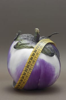 Fresh Ripe eggplant isolated on brown background to understand a concept of healthy eating