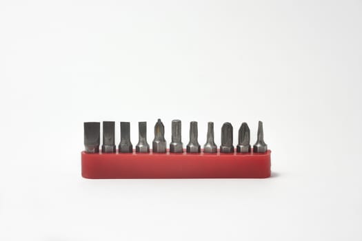 Front view of screwdriver bits in their plastic holders on white background