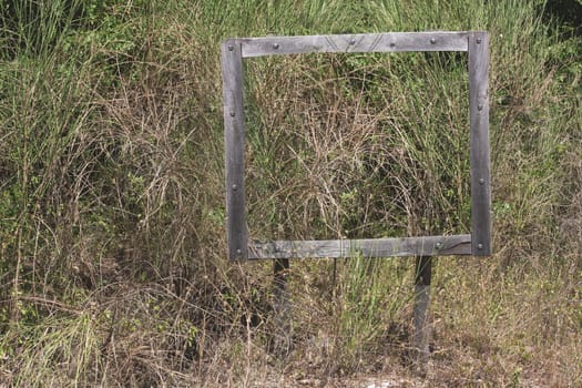 Old wooden sign in a state of neglect