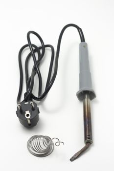 Soldering iron with plastic handle and gray wire