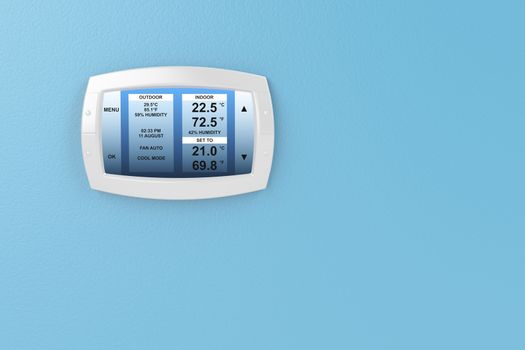 Digital thermostat on blue wall