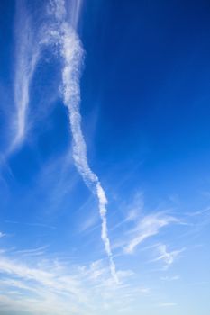   the dark blue sky on which there are white clouds