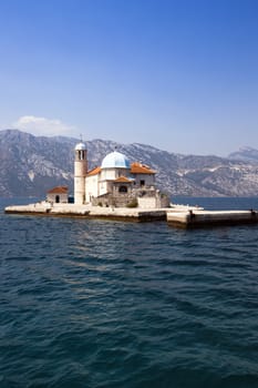  Church of the Virgin of Rock located in the Kotor bay, Montenegro. Summer