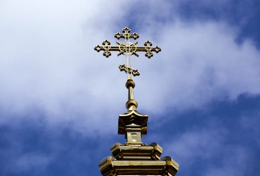  the gilded orthodox cross located on a dome of orthodox church. Belarus