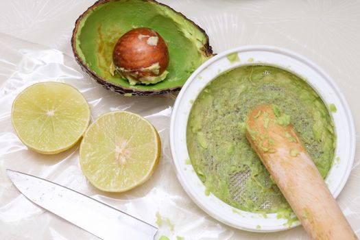 making puree food for baby made by avocado and lemon