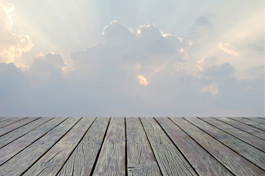 wooden floor with beautiful sunbeam on sky