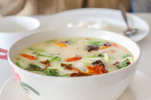 Thai  spicy chicken soup in coconut milk ,mushrooms, intensely flavor of galangal, lemongrass, kaffir lime leaf, cilantro