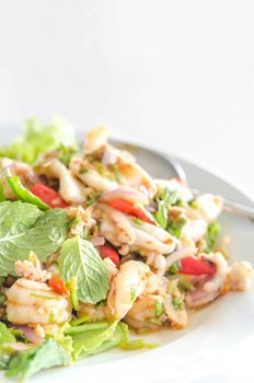 asian spicy salad with seafood and vegetables