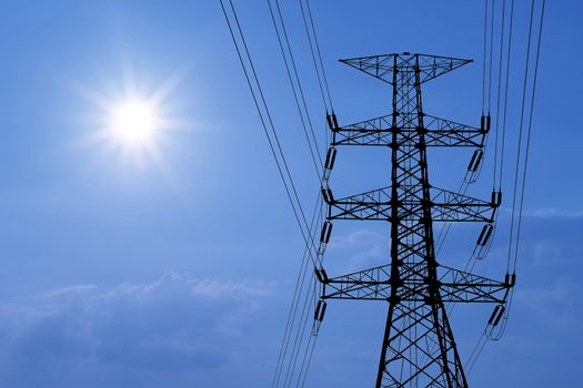 silhouette of high voltage electric tower with beautiful sunlight  background