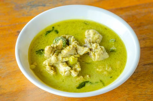 Green Chicken Curry in bowl on wooden background ,Thai cuisine