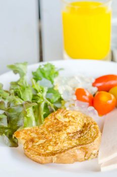 French toast ham cheese and salad on dish