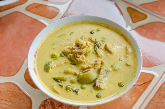 Green Chicken Curry in bowl on wooden background ,Thai cuisine