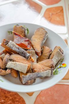 Crispy fish  with garlic and green vegetable , close up seafood dish