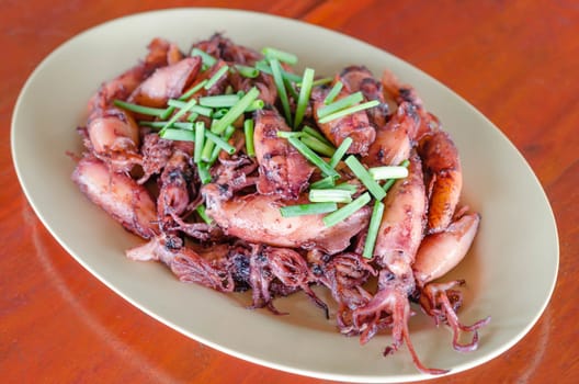 plate of sauteed small squid fried with garlic and sauce