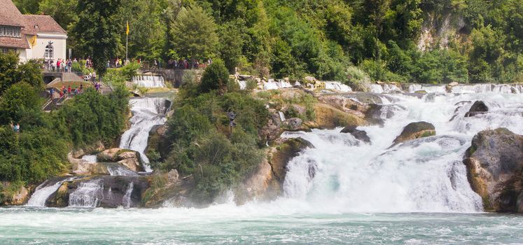 RHEINFALLS, SWITZERLAND - JULY 25, 2015: View to the biggest waterfalls of Europe in Schaffhausen, Switzerland on May 17, 2015. They are 150 m (450 ft) wide and 23 m (75 ft) high.