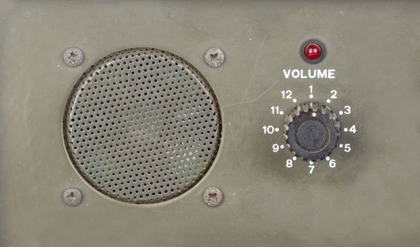 old style dial volume switch with speaker and red light indicator