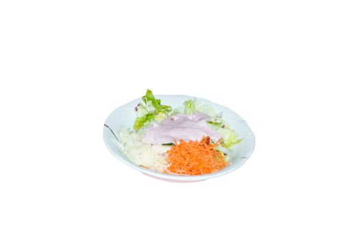 Salad with vegetables on a plate against a white background.