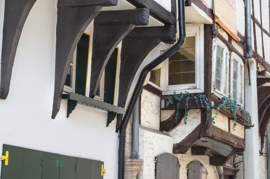 Old half-timbered wall of a historic half-timbered house in a town in Germany