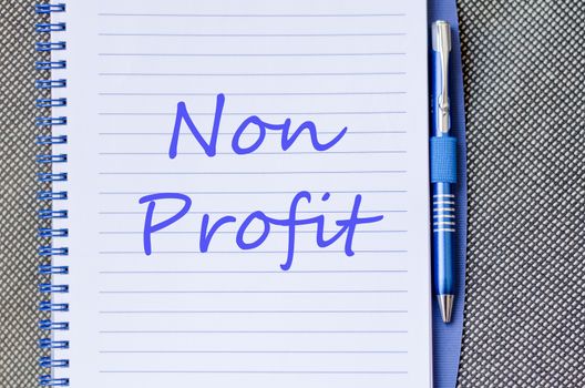 Blue notepad and Non profit text concept