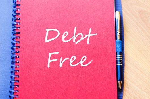 Red notepad and Debt free text concept
