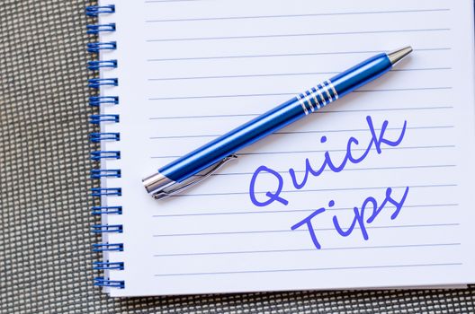 Notepad and pen on wooden background and text concept