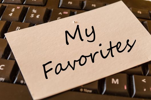 My favorites text concept note on dark keyboard background