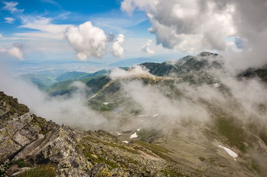 Landscape in clouds of Retezat National Park mountains in South Carpatians, Transylvania, Romania, Europe. 