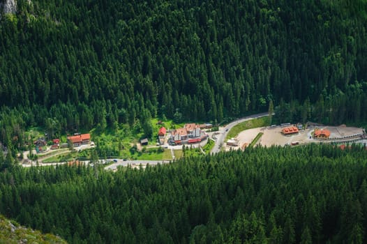 Bird view from Suhardul Mic mountain to populated valley in Red Lake AKA Lacu Rosu area, Carpathians Romania.