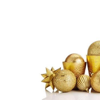 Composition of gold Christmas decorations on white background. White copy space for your text and logo.