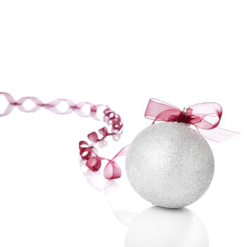 Silver Christmas ball with red bow. Copy space.