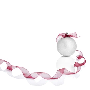 Silver Christmas ball with red bow. White copy space for your text and logo.