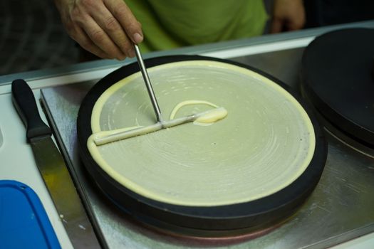 Crepes prepared from a street vendor to be filled with chocolate