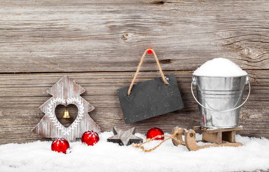 Christmas decoration with xmas canes, over wooden background