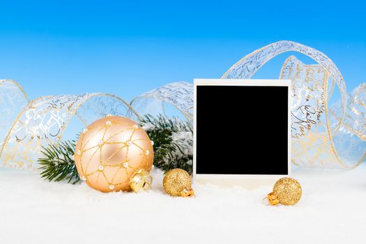 Christmas decoration over snow, blue background