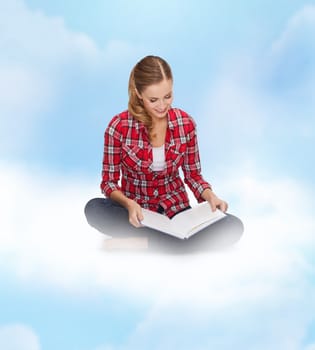 education and leisure concept - smiling young woman sitting on floor with book