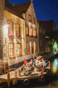 Old brick house in bruges at night

