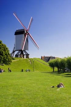 Wind mill and green lawn at Brugge - Belgium